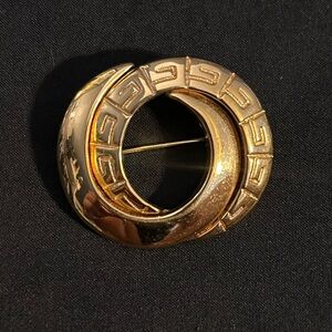 Vintage Givenchy gold color brooch.